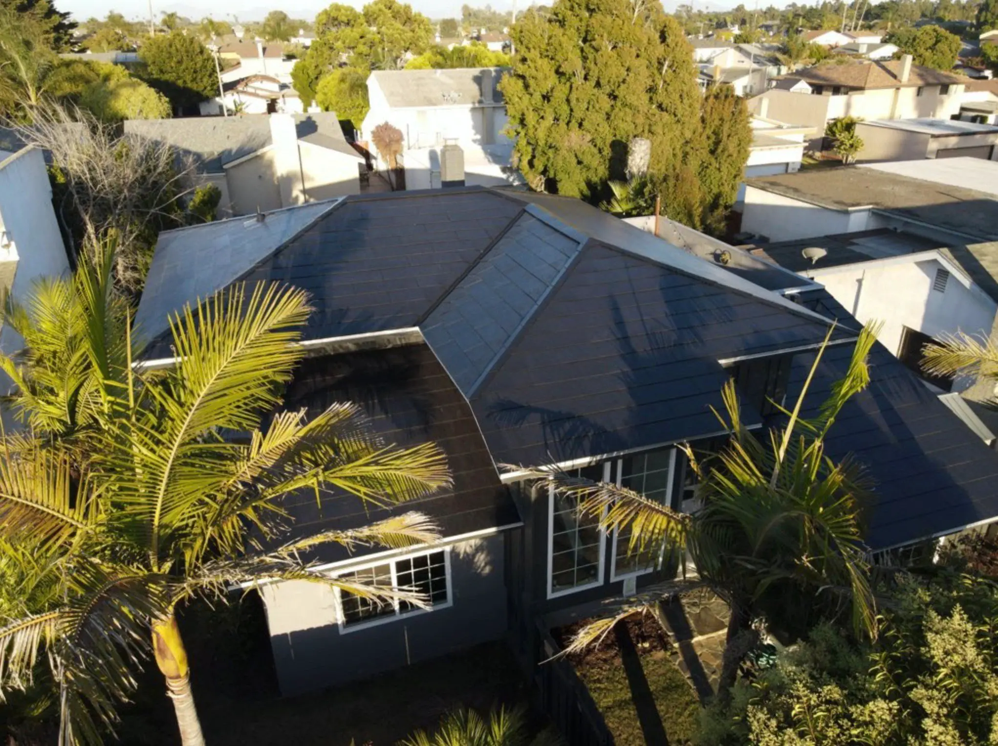 A Tesla Solar Roof system is deployed for under $30,000 ...