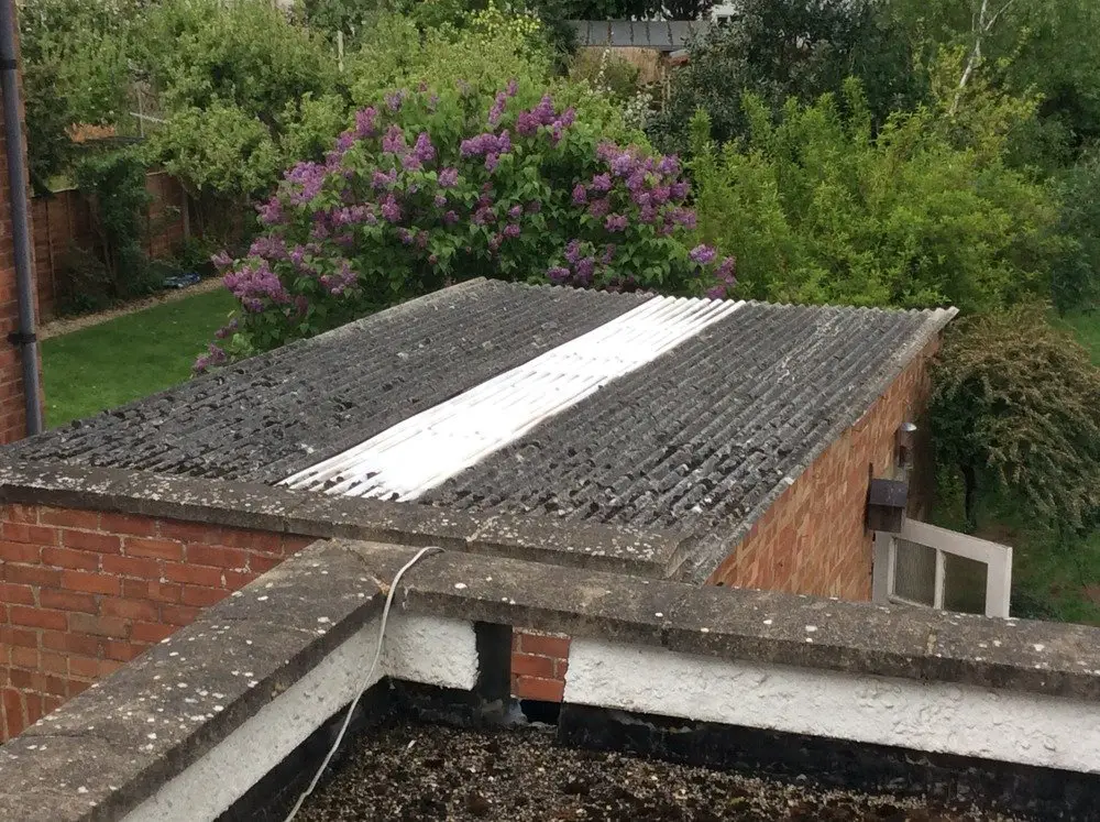 Fix leaking 1930s asbestos garage roof