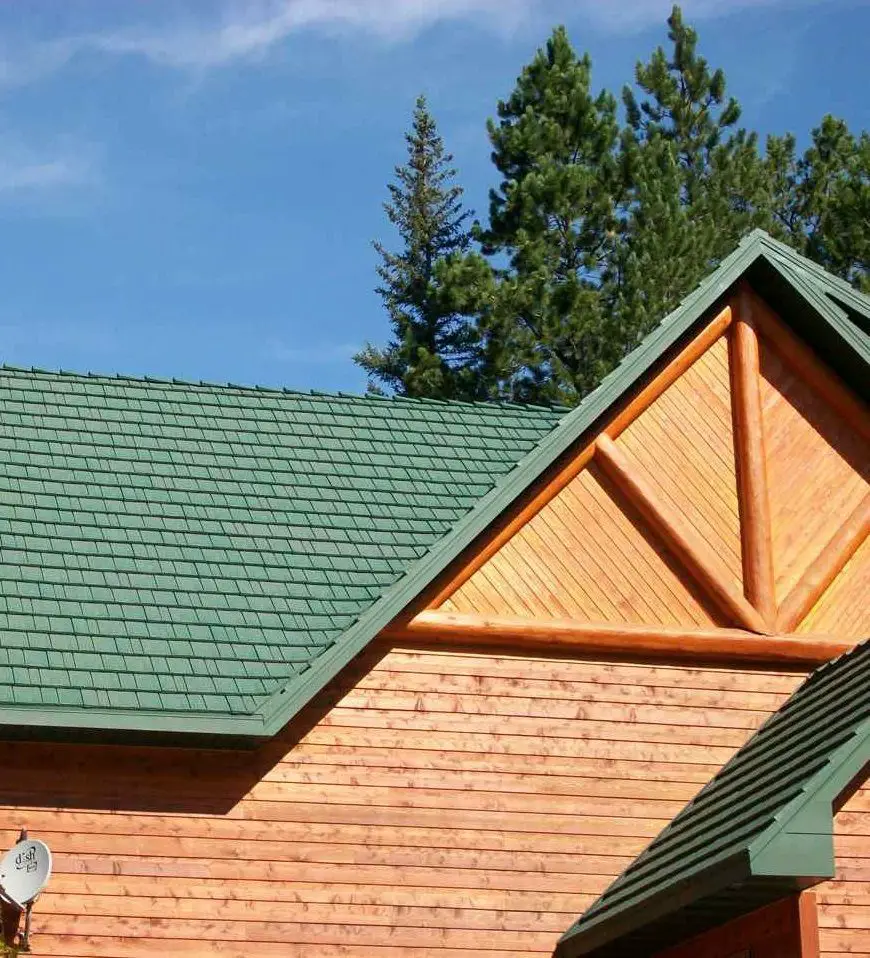 Green " Tin"  Roof on a Log Cabin