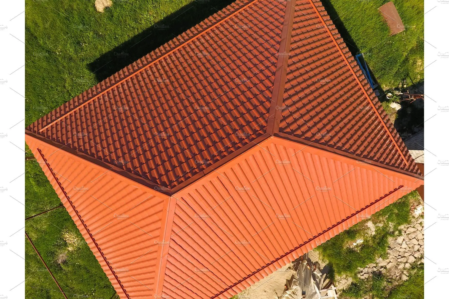House with an orange roof made of metal, top view ...