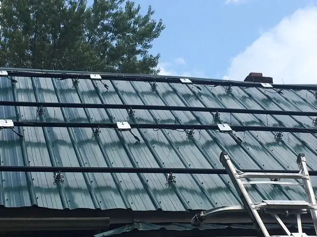 How are solar panels secured to my roof?