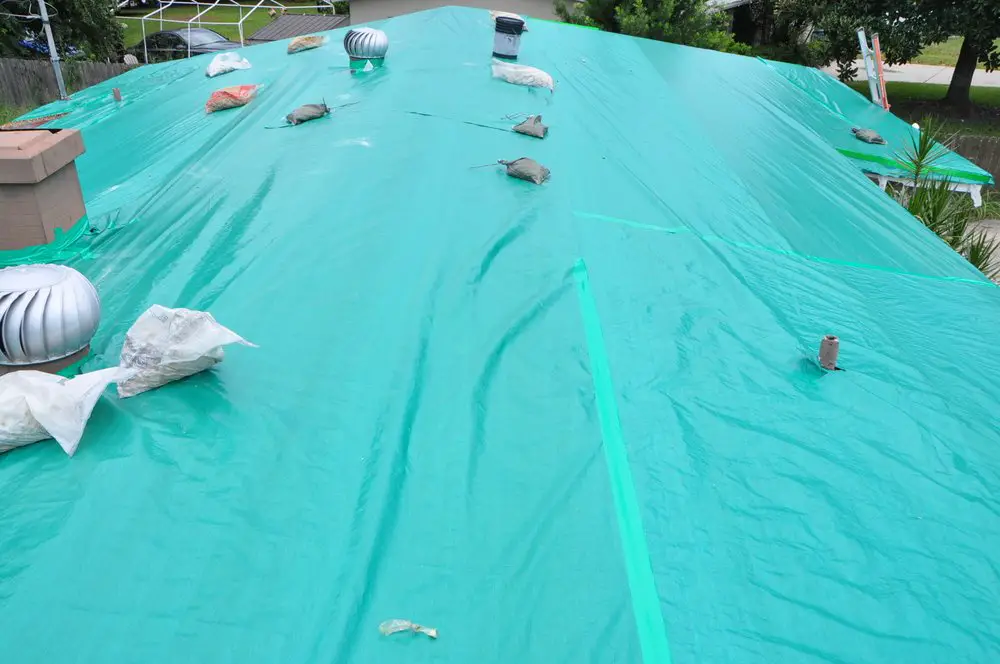 How to install a roof tarp on a gravel roof.  Orlando Roof Tarping ...