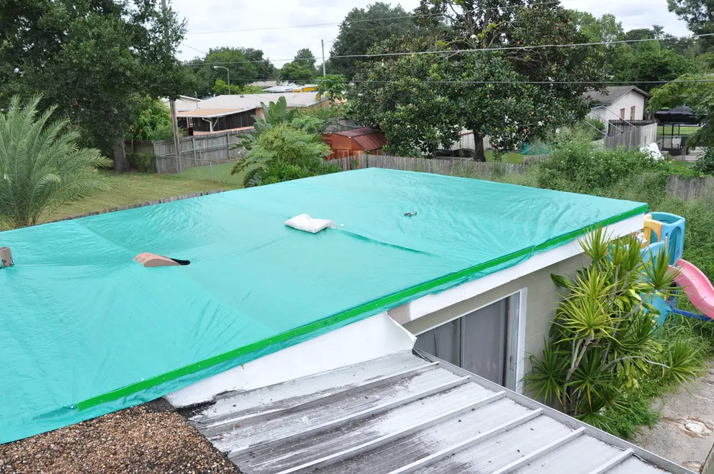How to install a roof tarp on a gravel roof.  Orlando ...