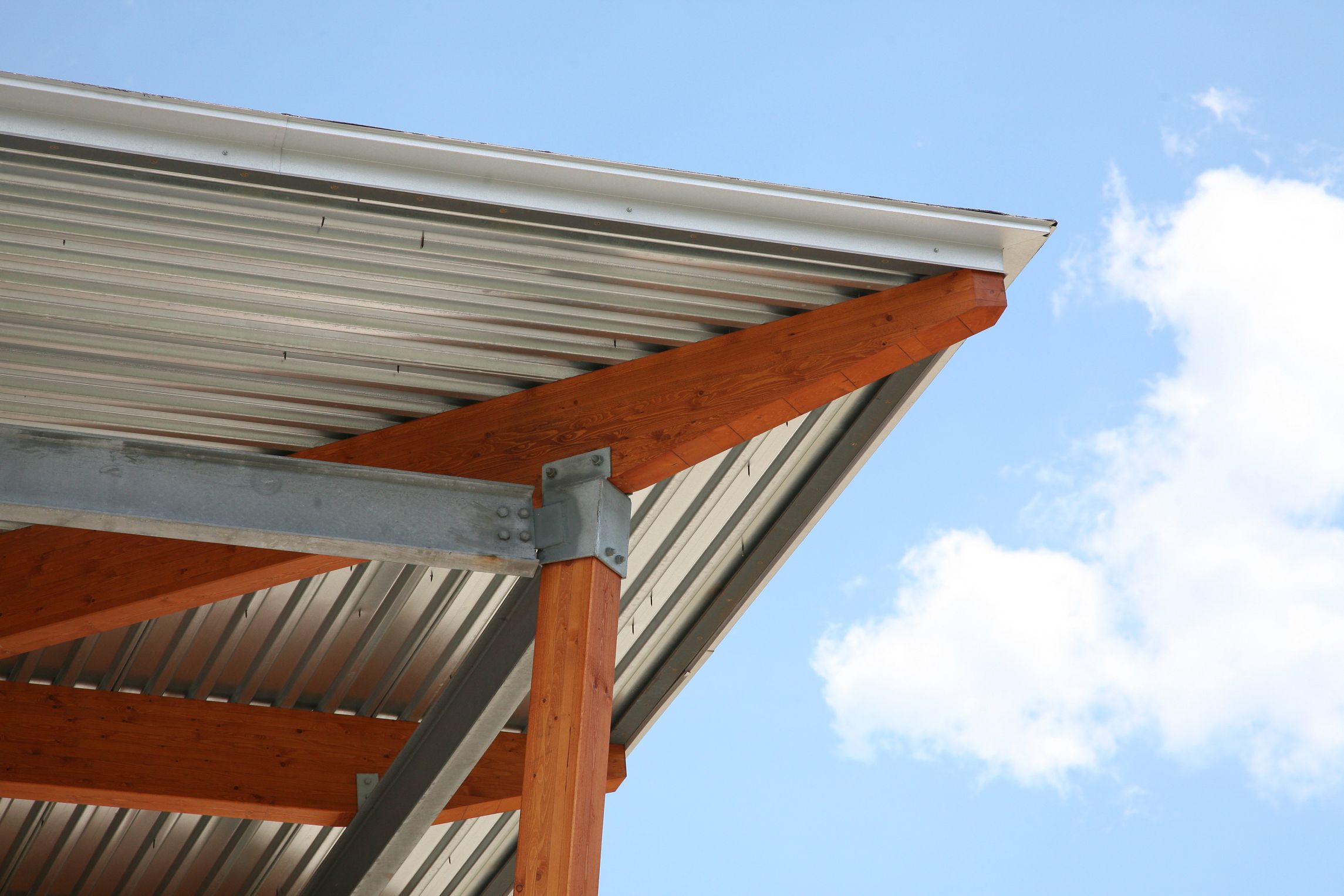 How to Install Corrugated Roof Panels Under a Deck