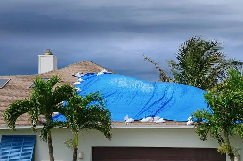 How to Put a Temporary Tarp on a Leaking Roof (&  Cost Quotes)