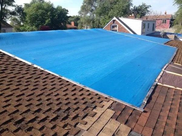 Install A Blue Tarp On A Roof