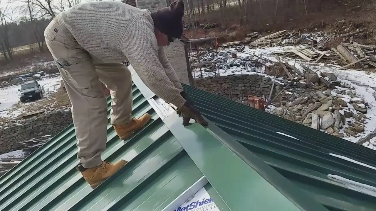 installing metal.ridge cap on standing seam barn roof ...