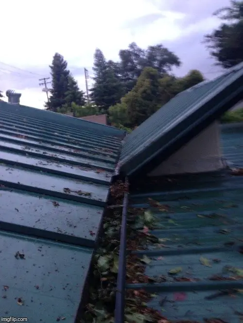 Metal roof installed over 2 shingle layers last October ...
